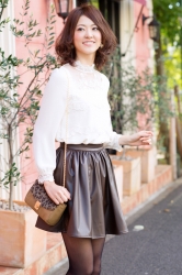 This is a full-length photo of Ms. Rikomi Nakajyo, she is a Japanese & Asian mature beauty fashion model, her height is 171 cm and she is tall, she is wearing white long-sleeved blouse and black short skirt, she is in a fashionable town, her style is very good.