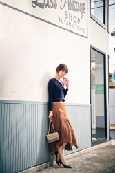 A Japanese & Asian fashion model named Ms. Sumiri, she is wearing a blue long-sleeved shirt and brown skirt, her height is 171 cm and she is tall, her style is very good.