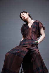 Ms. Anju was born in 1995, she is 176 cm tall, she is a Japanese & Asian fashion model & catwalk model (runway model), she is a tall & slender, she is dressed in reddish brown.