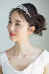 Ms. Arine Koen is a very beautiful & elegant Japanese & Asian beauty fashion model, she is 173 cm, she is tall and slender, she is dressed in white and has a tiara on her head.