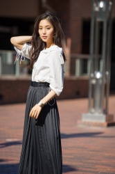 Ms. Arine Koen is a very beautiful & elegant Japanese & Asian beauty fashion model, she is 173 cm, she is tall and slender, she wears a white short-sleeved blouse and a dark skirt.