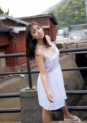 Ms. Aiko Sawashiro is wearing a white dress, she is standing on a small bridge, she is a sweet and cute young Japanese & Asian gravure idol (bikini model, swimsuit model, pin-up girl), TV personality, actress, her bust is 88 cm, she has mesmerizing big breasts, beautiful breasts, she is sexually attractive women.