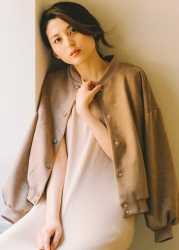 Ms. Atsumi Aonami wears brown jacket, light brown dress, she is sitting, she is a beautiful and elegant mature Japanese & Asian fashion model, her height is 173 cm, her body is very slender and pretty.