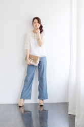 Ms. Keina Ashikubo is wearing a white short-sleeved blouse and blue trousers, she has a bag, she is a Japanese & Asian mature beauty fashion model, she is 170 cm tall and has a very slim and beautiful, elegant figure.