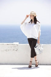 Ms. Keina Ashikubo is wearing a white short-sleeved blouse, black trousers, she wears a hat and has a silver bag, she is a Japanese & Asian mature beauty fashion model, her height is 170 cm, she is very slim and beautiful, elegant.