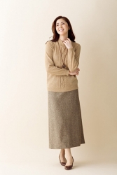 Ms. Keina Ashikubo is wearing a brown sweater and brown skirt, brown shoes, she is a Japanese & Asian mature beauty fashion model, her height is 170 cm, she is very slender and beautiful, elegant.