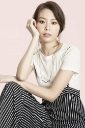 Ms. Eri Noina is wearing a white short-sleeved blouse, black and white striped trousers, she is a tall and beautiful Japanese & Asian fashion model, parts model, her height is 171 cm, she is tall, her figure is very slim and beauty woman.