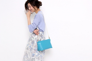 Ms. Fuyuka Shikadate is wearing light blue blouse and white skirt and a small bag on her shoulders, her height is 171 cm and she is tall, she is a Japanese & Asian mature female fashion model.