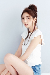 Ms. Fuyuka Shikadate is wearing white short-sleeved blouse and denim shorts, her height is 171 cm and she is tall, she is a Japanese & Asian mature female fashion model.