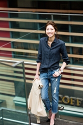 Ms. Fuyuka Shikadate is wearing a dark blue tailored shirt and jeans, her height is 171 cm and she is tall, she is a Japanese & Asian mature female fashion model.