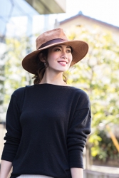 Ms. Hikane Doki is wearing a dark blue long-sleeved blouse and a straw hat, she is a Japanese & Asian fashion beauty model.