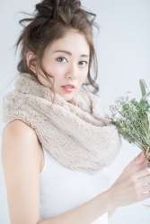 Ms. Hikane Doki is wearing a white shirt with a scarf around her neck and holding flowers in her hands, she is a Japanese & Asian fashion beauty model.