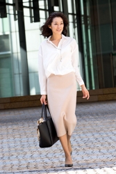 Ms. Namiri Ishiba is wearing a white long-sleeved blouse, pink skirt, she is walking outside, she is a Japanese & Asian beautiful and elegant mature female fashion model.