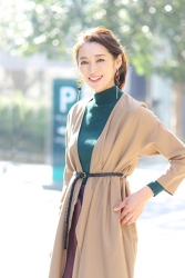 Ms. Namiri Ishiba is wearing a brown robe, green long-sleeved turtleneck pullover, she is a Japanese & Asian beautiful and elegant mature female fashion model.