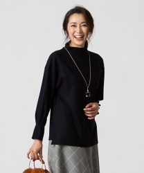 Ms. Namiri Ishiba is wearing a black long-sleeved blouse with a bag in her hand, she is a Japanese & Asian beautiful and elegant mature female fashion model.