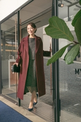 Ms. Namiri Ishiba is wearing a burgundy coat and dark gray dress, she is a Japanese & Asian beautiful and elegant mature female fashion model.