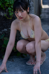 Ms. Fuuwa Sakakura is wearing a yellow bikini swimsuit, she is squatting, she is a beautiful and cute young gravure idol (bikini model, pin-up model, swimsuit model) from Japan, her bust is 83cm, she has beautiful breasts.