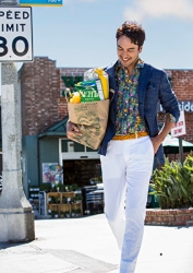 Mr. Rodrigue Takise is wearing a blue jacket and white trousers, he has shopping bags, he is a half Japanese half French handsome mixed-race male model.