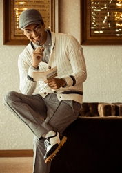 Mr. Rodrigue Takise is wearing a white sweater, gray tailored shirt, gray trousers and a gray hat, he is a half Japanese half French handsome mixed-race male model.