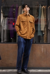 Mr. Ryuutarou Oshikoshi is standing in a brown cut shirt and jeans, he is a Japanese & Asian handsome fashion model.