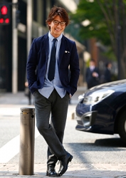 Mr. Takaatsu Sakurahaba is wearing blue clothes, he is wearing a blue tie, he is standing in the street, he is a handsome Japanese & Asian actor, fashion male model.