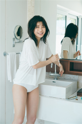 Ms. Ayuu Koichi wears a white T-shirt and white lingerie, she is on the washstand, she is standing here, she is a beautiful Japanese & Asian big breasts TV entertainer, bikini model (gravure idol, swimwear model), actress.