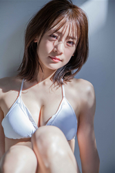 Ms. Yumina Fukue is wearing a white bikini swimsuit, she is sitting on the floor grasping her knees, she is a beautiful and cute Japanese & Asian TV personality swimsuit model (gravure idol, bikini model, pin-up girl).