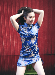 Ms. Aisui Saito is wearing a blue cheongsam, she is holding her hair, she is a beautiful and sexy Japanese & Asian gravure idol (bikini model, swimsuit model, pin-up girl), actress, her bust is 85 cm, she has beautiful breasts, she is a woman with sexual charm.