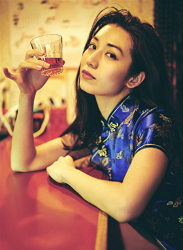 Ms. Aisui Saito is wearing a blue cheongsam and sitting at a bar seat, she is a beautiful and sexy Japanese & Asian gravure idol (bikini model, swimsuit model, pin-up girl), actress, her bust is 85 cm, she has beautiful breasts, she is a woman with sexual charm.