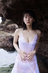 Ms. Rihoko Yoshikoshi is wearing a white slip, white bikini swimsuit, she is standing on the shore, her body is wet, she is a beautiful and elegant Japanese & Asian actress, gravure idol (bikini model, swimwear model, pin-up model), she has charming beautiful breasts.