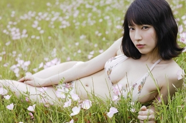 Ms. Rihoko Yoshikoshi is wearing white lingerie (with a floral pattern), she is lying on the grass, she is a beautiful and elegant Japanese & Asian actress and swimsuit model, she has charming beautiful breasts.