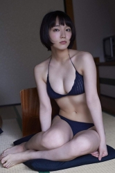 Ms. Rihoko Yoshikoshi is wearing a blue bikini swimsuit, she is sitting in a Japanese style room, she is a beautiful and elegant Japanese & Asian actress and gravure idol (bikini model, swimwear model, pin-up girl), she has charming beautiful breasts.