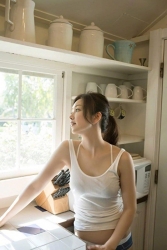 Ms. Yuuri Fuefuki is wearing a white running shirt and blue panties and is in the kitchen, she is a Japanese & Asian intellectual, delicate and mature beauty actress & model, her title is actress, and she has done a little modeling business.
