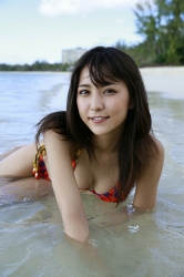 Ms. Miren Ishigane is wearing a red/purple two-color bikini swimsuit, she's on the beach and she's in the sea, she is a beautiful & cute Japanese (Asian) fashion model, actress, TV entertainer, bikini model (gravure idol, swimsuit model, pin-up model), herbust is 83cm, she has beautiful breasts.