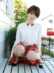 Ms. Sarara Oshinari is wearing white tailored shirt and red skirt, she is squatting, she is a beautiful and sexy Japanese & Asian flat gravure idol (pin-up girl, bikini model), actress, her bust is 92cm, she has big breasts, beautiful breasts, she is a sexually attractive woman.