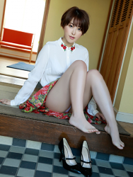 Ms. Sarara Oshinari is wearing white tailored shirt and red skirt, she is sitting in front of the front door, she is sitting on the floor grasping her knees, she is a beautiful and sexy Japanese & Asian flat gravure idol (pin-up girl, bikini model), actress, her bust is 92cm, she has big breasts, beautiful breasts, she is a sexually attractive woman.