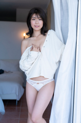 Ms. Yukina Fujihana is a sexy gravure idol (swimwear model, bikini model), TV personality, actress wearing white panties & white cardigan, she is standing.