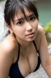 Ms. Aiko is wearing a dark blue bikini swimsuit, she is in riverside, she is a sweet and cute young Japanese & Asian bikini model (gravure idol, swimwear model, pin-up girl), TV personality, actress, her bust is 88 cm, she has a fascinating big breasts, beautiful breasts, she is an attractive woman.