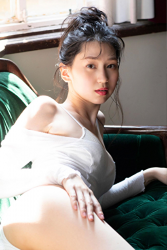Ms. Hitoha Korekiyo is lying on a green sofa in white lingerie, her height is 173 cm, she is tall, she is a tall fashion model, TV personality, actress, her bust is 84 cm, she has a beautiful breast.