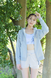 Ms. Naasu Takamichi is a very pure young Japanese & Asian fashion model and actress, wearing light blue casual clothes, she is standing.