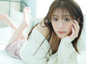 Ms. Naasu Takamichi wears white sweater, brown camisole, red trousers of young Japanese & Asian fashion model and actress, she lies face down in bed.