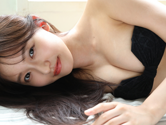 Ms. Neiro Shii is wearing a black bikini swimsuit, she is lying in bed, she is a beautiful and cute young Japanese & Asian bikini model (gravure idol, swimsuit model, pin-up girl), TV personality, freelance announcer.