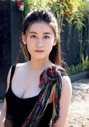 Ms. Eika is wearing a black camisole, she is standing on the road, she is a beautiful and cute Japanese & Asian bikini model (gravure idol, swimsuit model, pin-up girl), TV personality and actress, she used to be an idol singer.