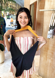 Ms. Eika Kamida is wearing a white/red two-color vertical striped dress, she is holding a blue dress in her hand, she is a beautiful and cute Japanese & Asian bikini model (gravure idol, swimsuit model, pin-up girl), TV personality, actress, she used to be an idol singer.