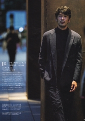 Mr. Hiroaki Kyusogami is wearing a dark blazer and pants and is standing, she is a handsome Japanese (Asian) actor, fashion model.