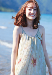 Ms. Syuuka Takatsu is a Japanese-Armenian mixed-race fashion beauty model (1/4 Armenian descent), she is a Japanese & Asian TV personality, fashion model, bikini model (gravure idol), she is wearing a green dress, she is standing by the river.