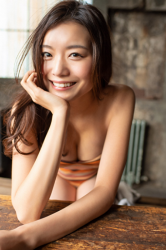 Ms. Amina Hachitsuka is a Japanese & Asian fashion model, TV personality, actress, gravure idol (bikini model, swimwear model, pin-up girl) wearing an orange (horizontal stripe pattern) swimsuit.