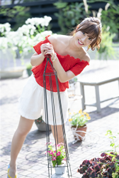 Ms. Ayaka Shibaie is wearing a red short-sleeved blouse and white shorts, she is a beautiful & cute Japanese & Asian model, freelance announcer, TV personality.