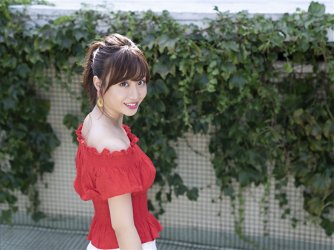 Ms. Ayaka is wearing a red short-sleeved blouse and white shorts, she is a beautiful & cute Japanese & Asian model, freelance announcer, TV personality, she is standing.