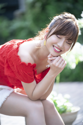 Ms. Ayaka Shibaie is wearing a red short-sleeved blouse and white shorts, she is sitting, she is a beautiful & cute Japanese & Asian model, freelance announcer, TV personality.